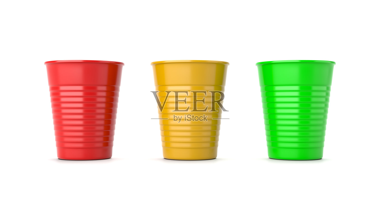 红色，黄色和绿色塑料杯上的白色照片摄影图片