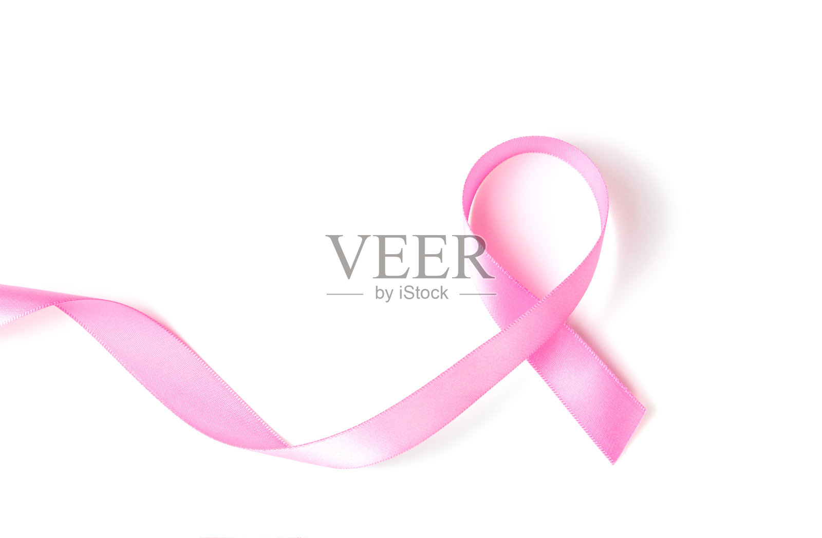 粉色丝带乳癌意识在白色背景与复制空间的文本，标志，或文字插入或装饰照片摄影图片