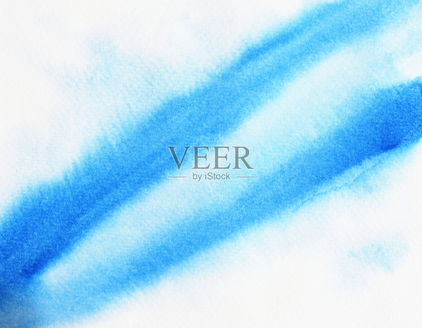 白色表面上有蓝色和绿色的污渍照片摄影图片