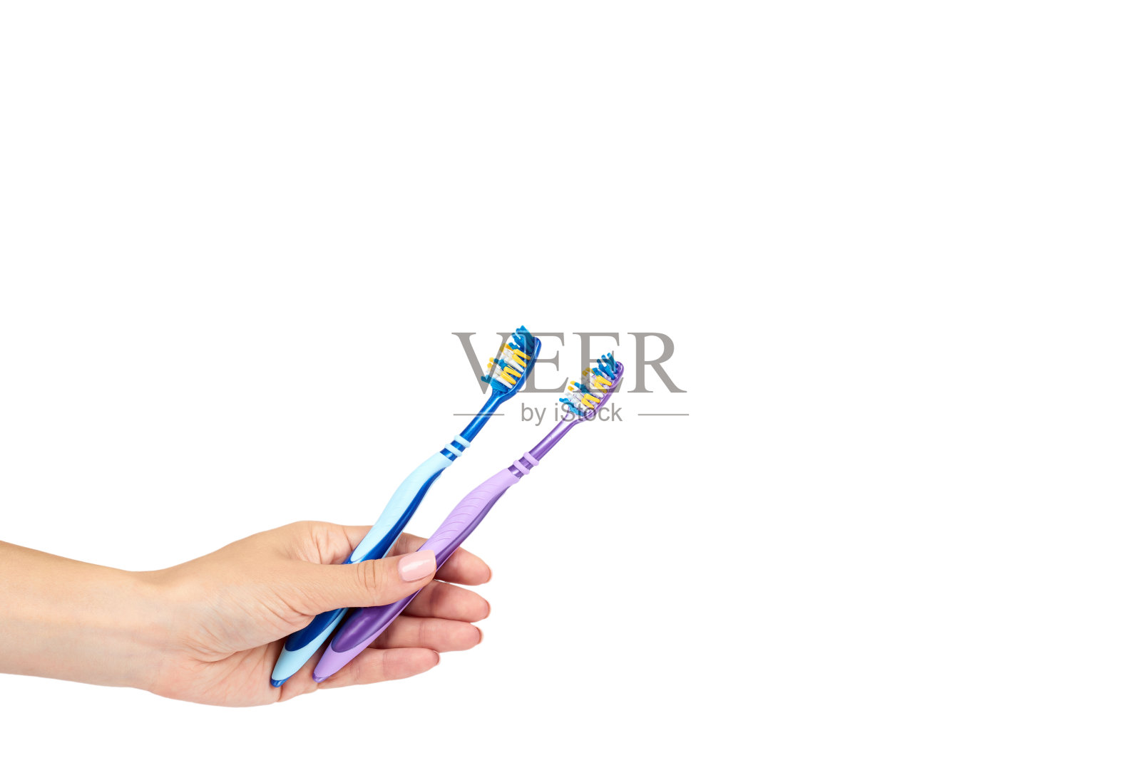 彩色新手动牙刷，带手柄，隔离在白色背景上，复制空间模板照片摄影图片