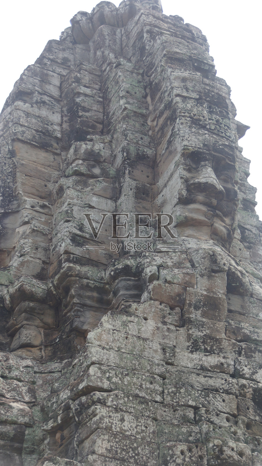 吴哥窟的巴戎神庙有200多张面孔，每一张都以自己独特的方式从每个角落注视着你照片摄影图片