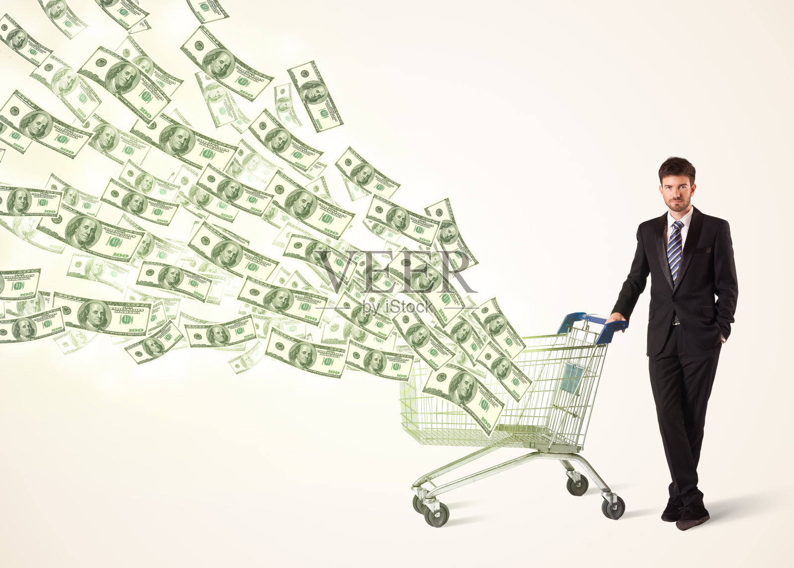 拿着美元购物车的商人照片摄影图片