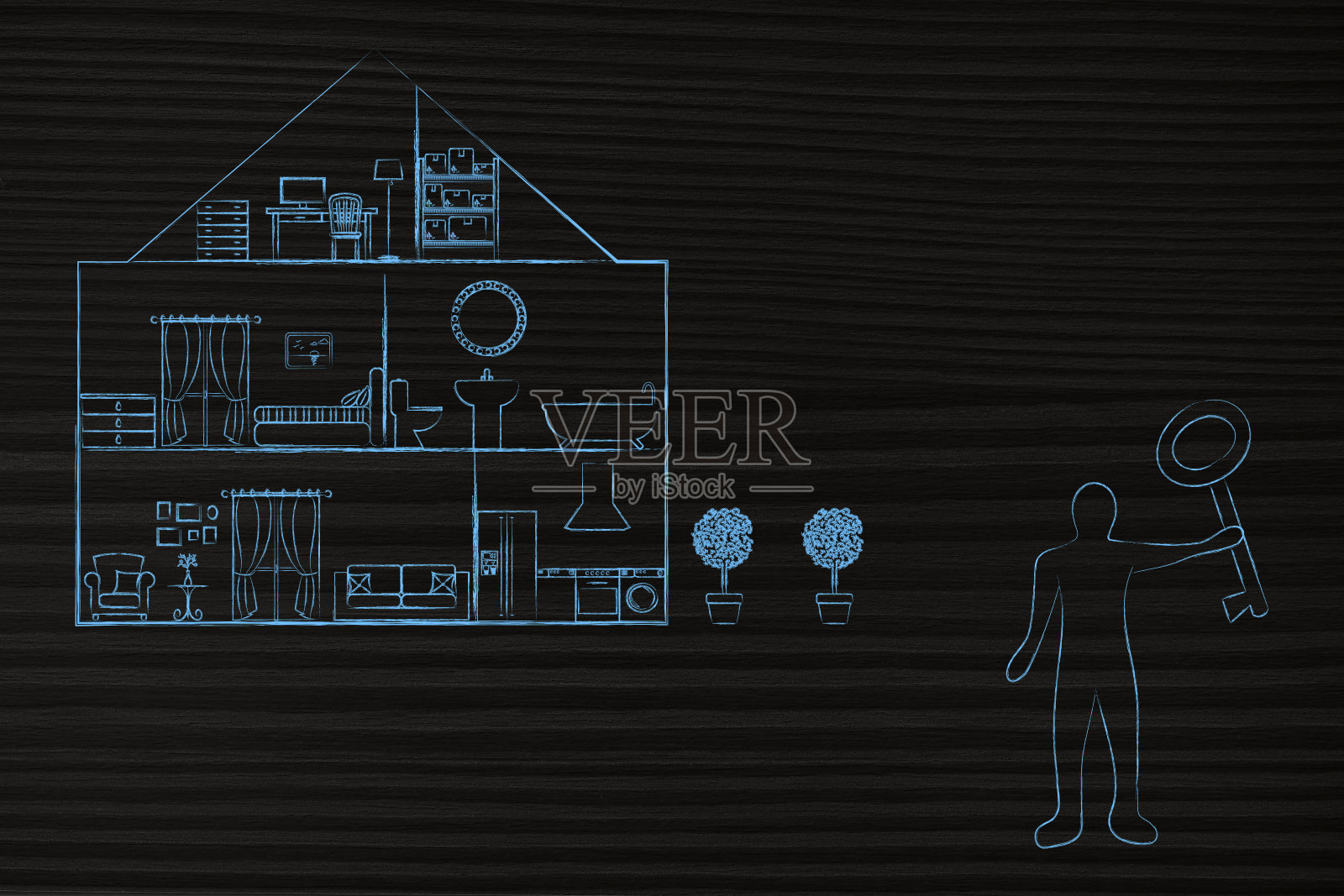 一个拿着特大号钥匙的男人站在新房子前照片摄影图片