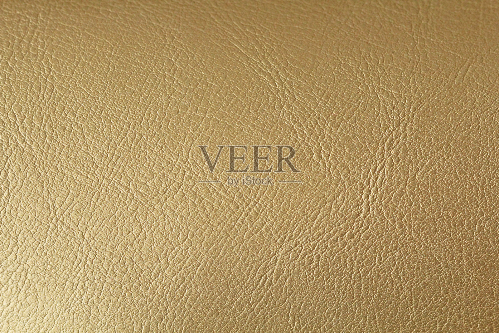 黄金或青铜自然皮革背景。黄叶金箔质地光泽背景。文本的地方照片摄影图片