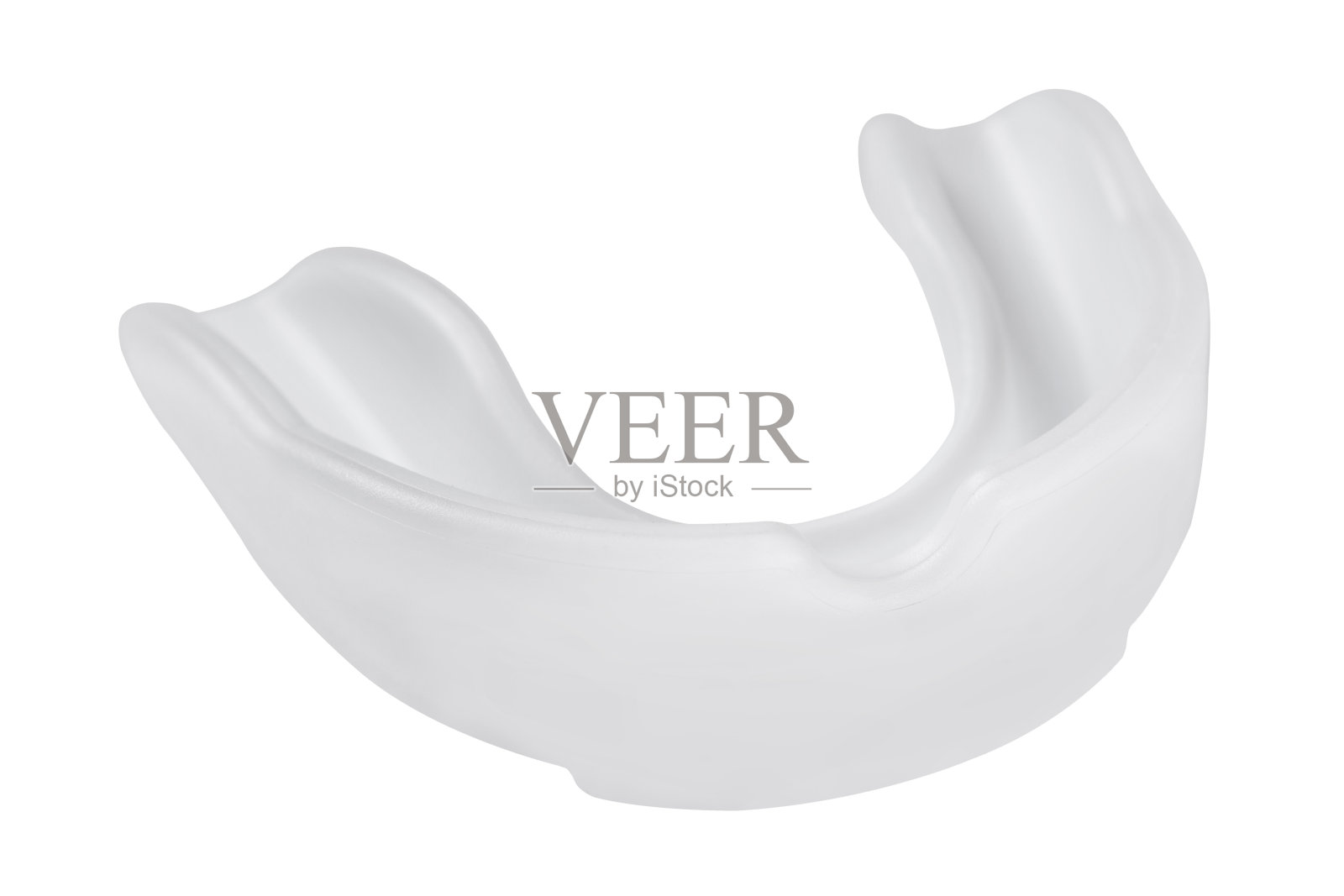 白色运动护齿，保护牙齿在白色背景橡胶盒上，隔离照片摄影图片