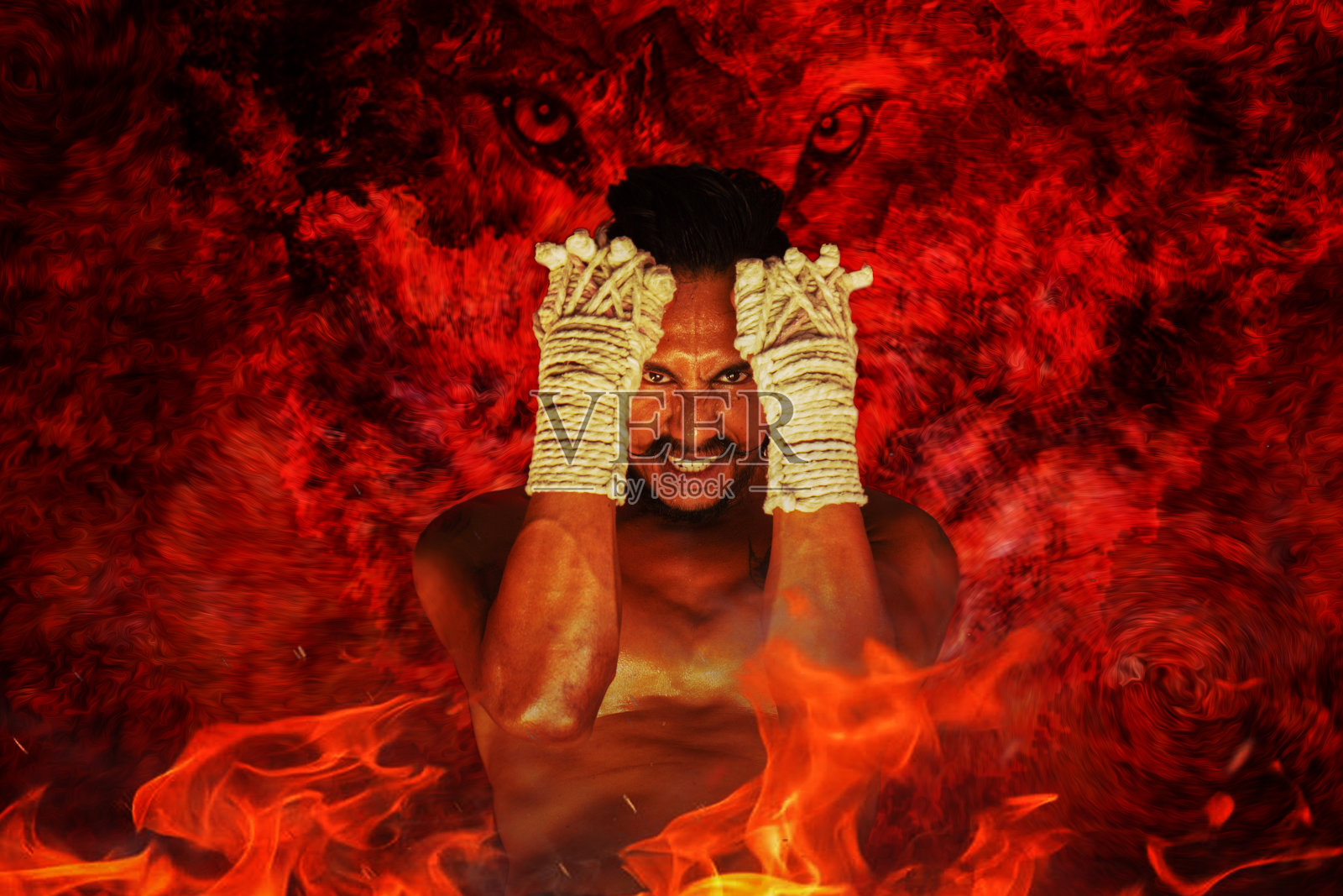 背景的泰拳战士在战斗行动与背景的热量和前景的火焰火焰照片摄影图片