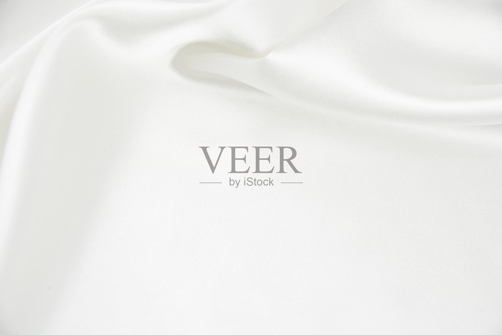 以白色为背景的缎纹织物的纹理照片摄影图片