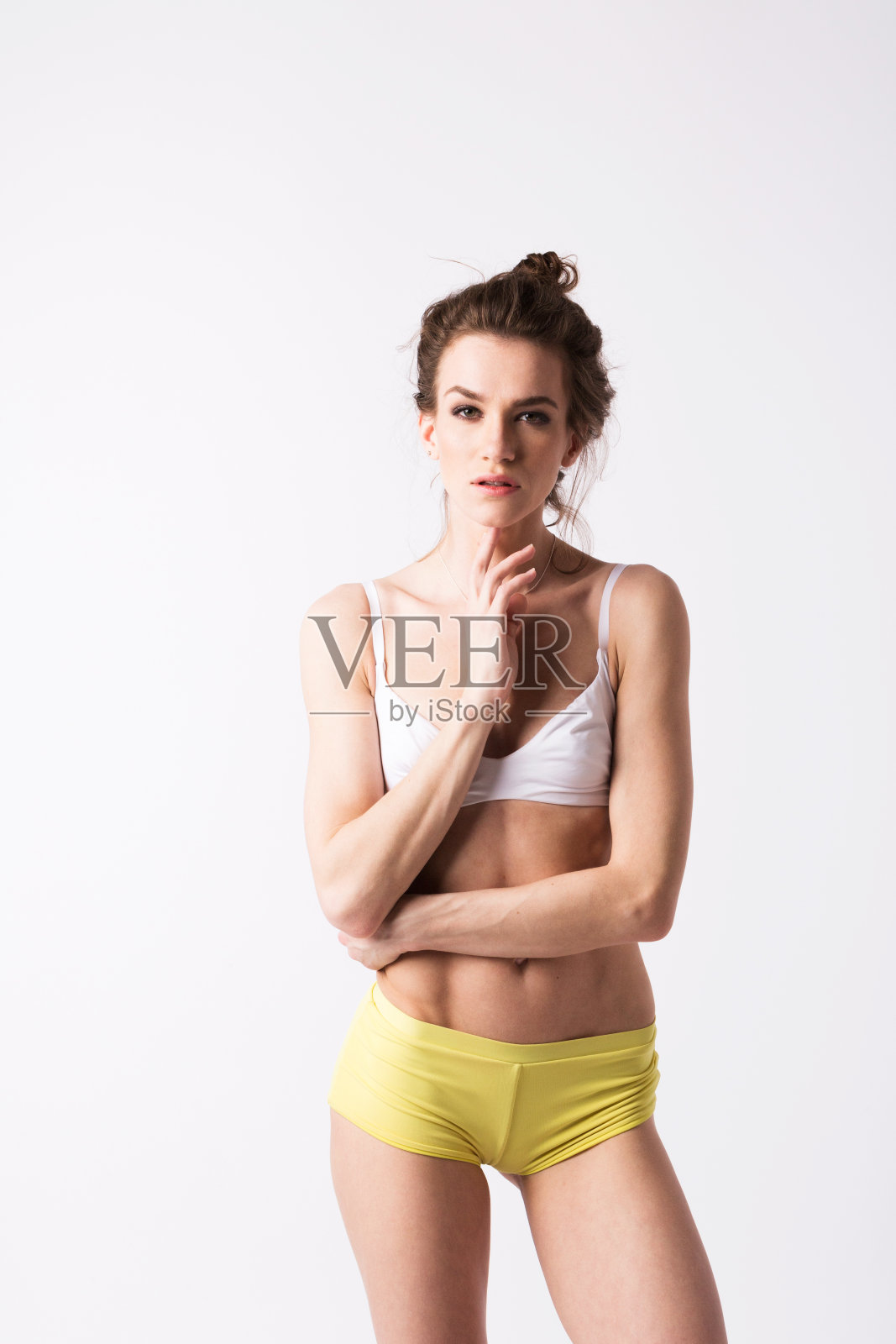 苗条的女人的身体在白色的背景。照片摄影图片