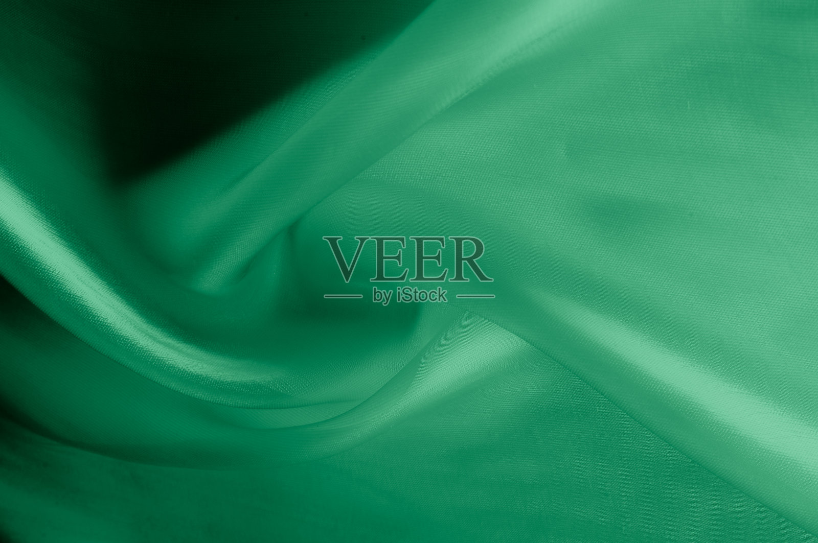 质地、背景、模式。淡绿色丝织物。这是非常柔软和薄的薄纱，柔软的丝绸薄纱。看起来像帷幔，比婚礼幻象软多了照片摄影图片