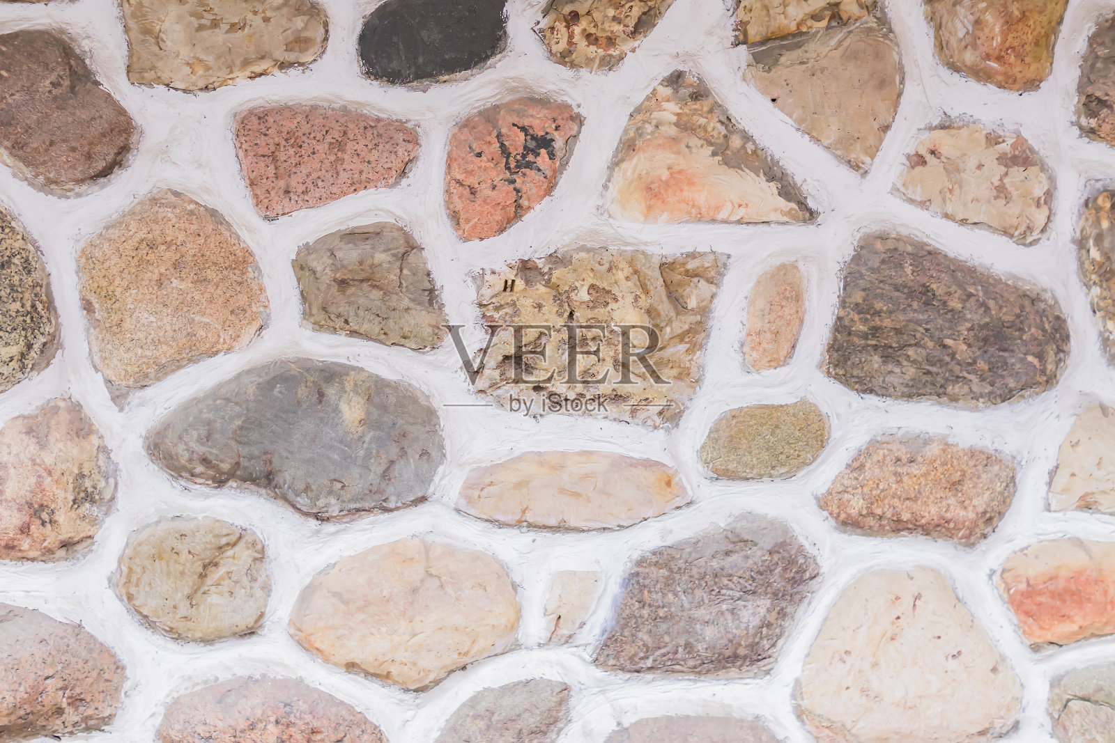 天然石墙背景。围栏由天然材料制成照片摄影图片