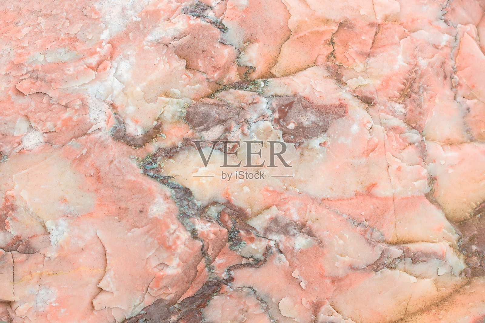 粉色大理石纹理背景。美丽的天然裂缝石材。照片摄影图片