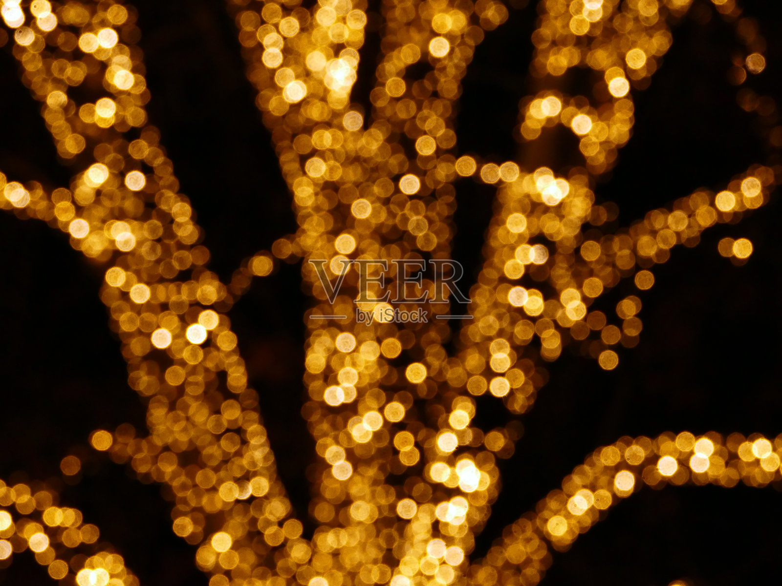 模糊的金色圣诞彩灯照片摄影图片