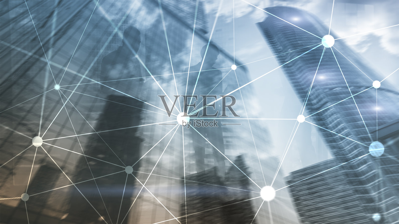 在模糊的摩天大楼背景上使用区块链网络。金融技术与通讯概念。照片摄影图片