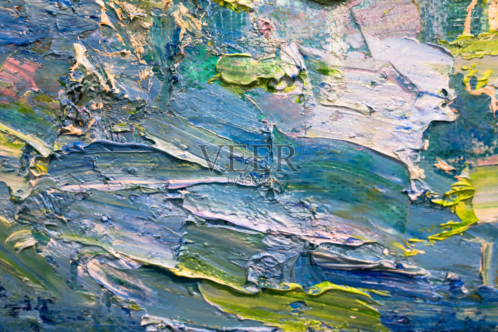 画家的调色板上油画的多色笔触。背景照片摄影图片