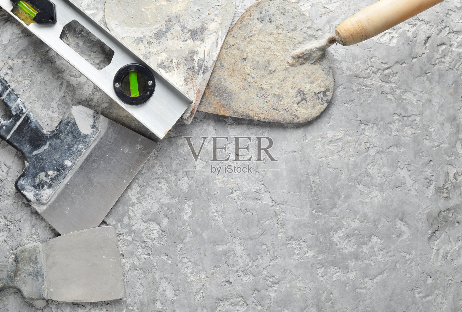 在灰色的混凝土背景上建造工具。抹刀，抹刀，水平尺，水平尺，拷贝空间，俯视图照片摄影图片