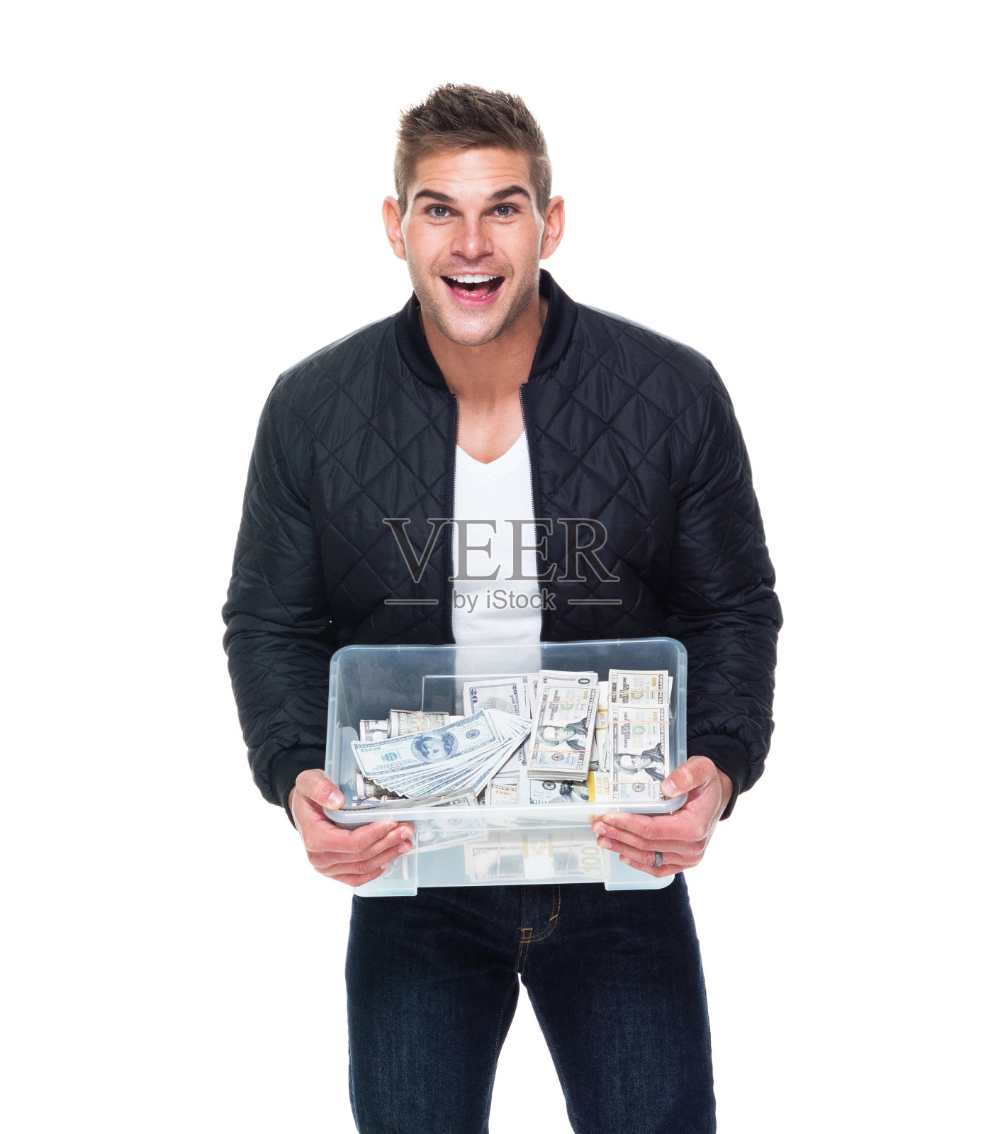 英俊的肌肉男拿着一箱现金照片摄影图片