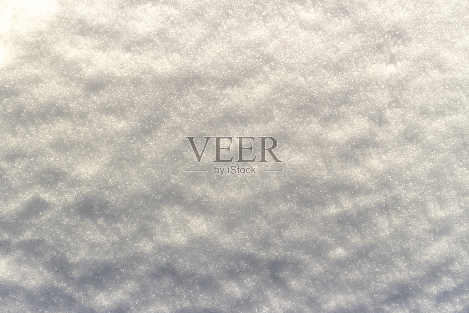 白色的雪表面与梯度阴影。照片摄影图片