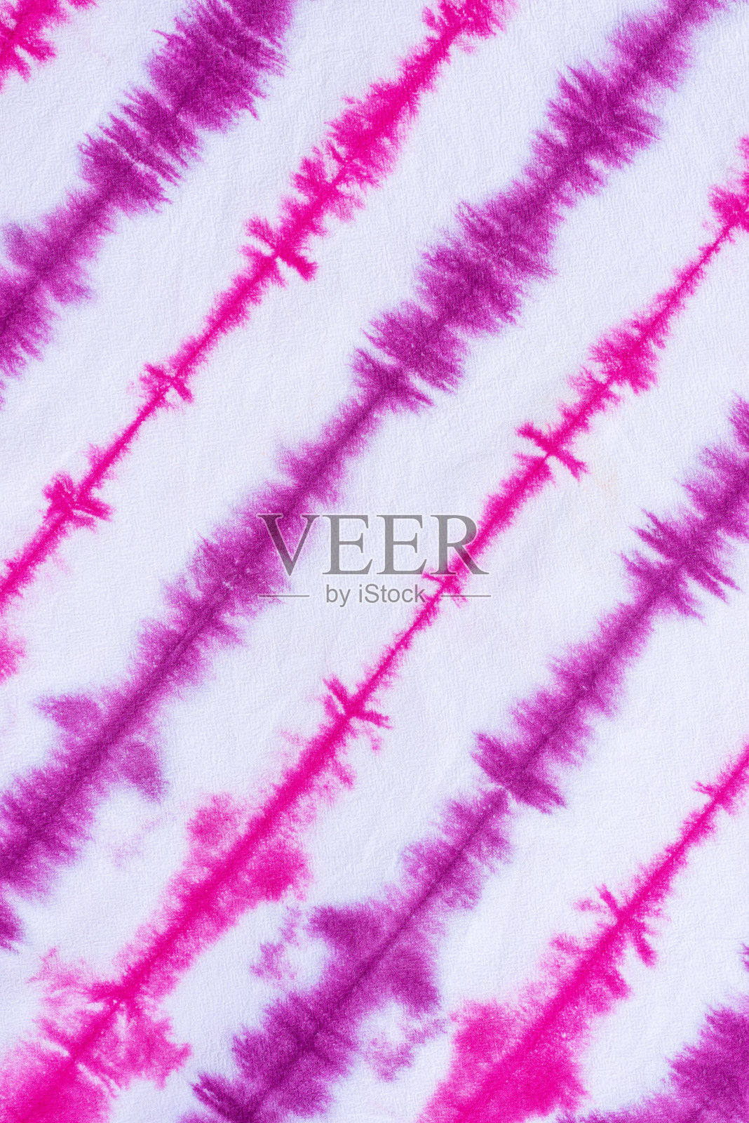 扎染图案抽象背景。照片摄影图片