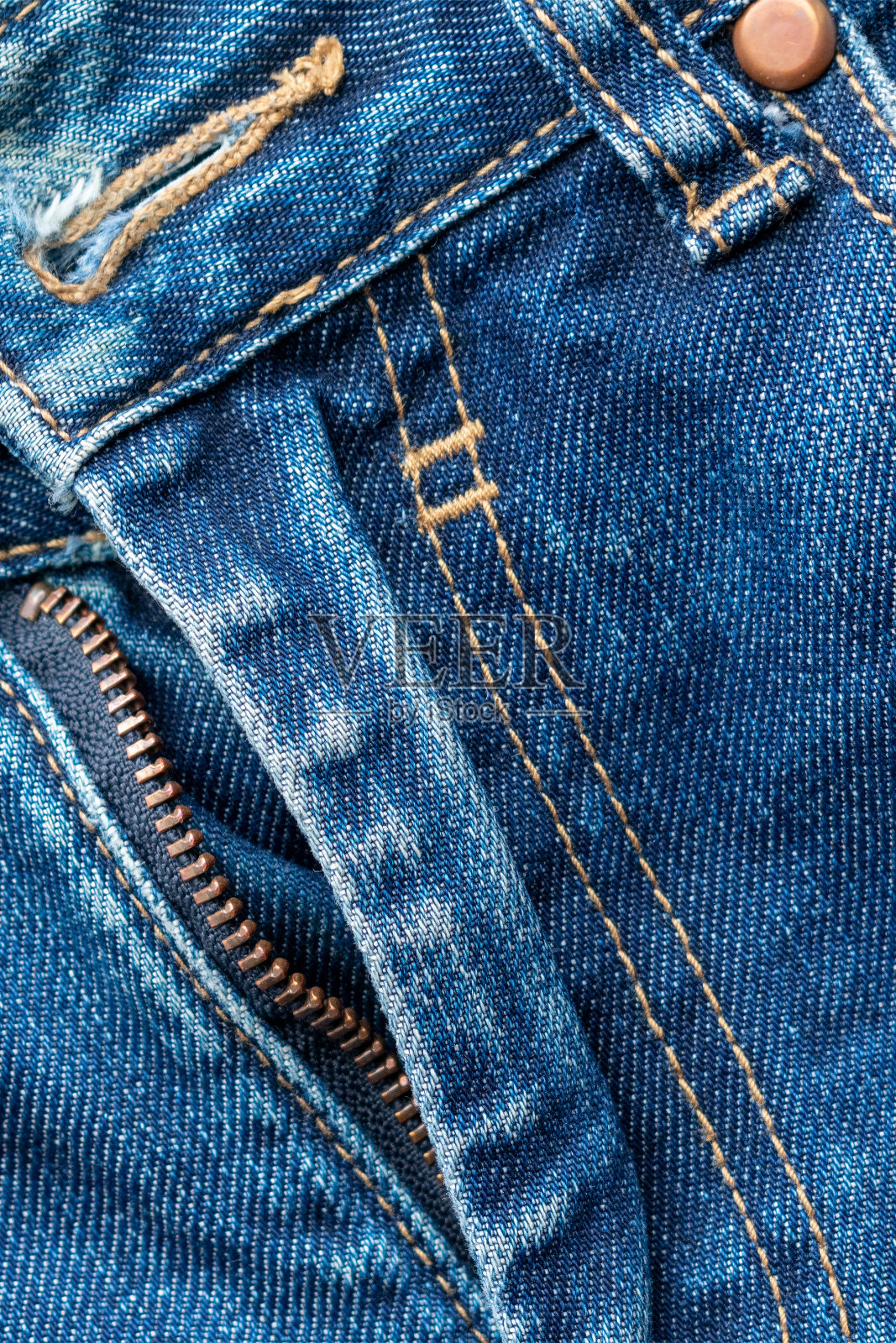 拉链牛仔裤。牛仔质地。照片摄影图片