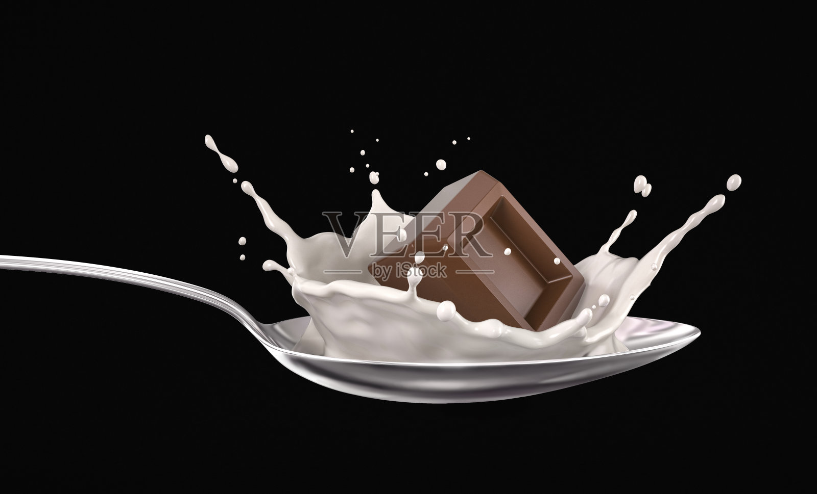 用金属勺将巧克力块倒入牛奶中。在黑色的。照片摄影图片