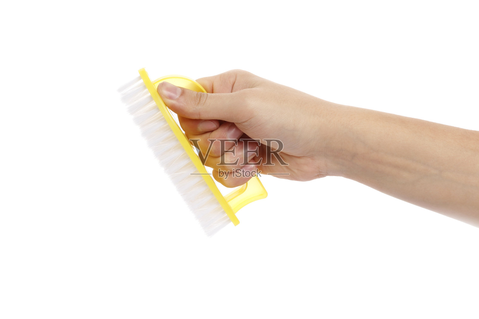 手握一个刷子孤立的白色背景照片摄影图片