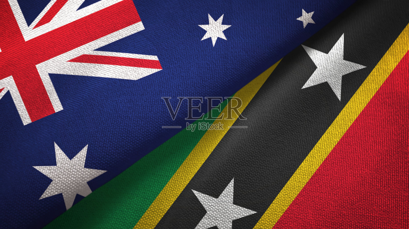 圣基茨和尼维斯两面旗布交织在一起，织物质地照片摄影图片