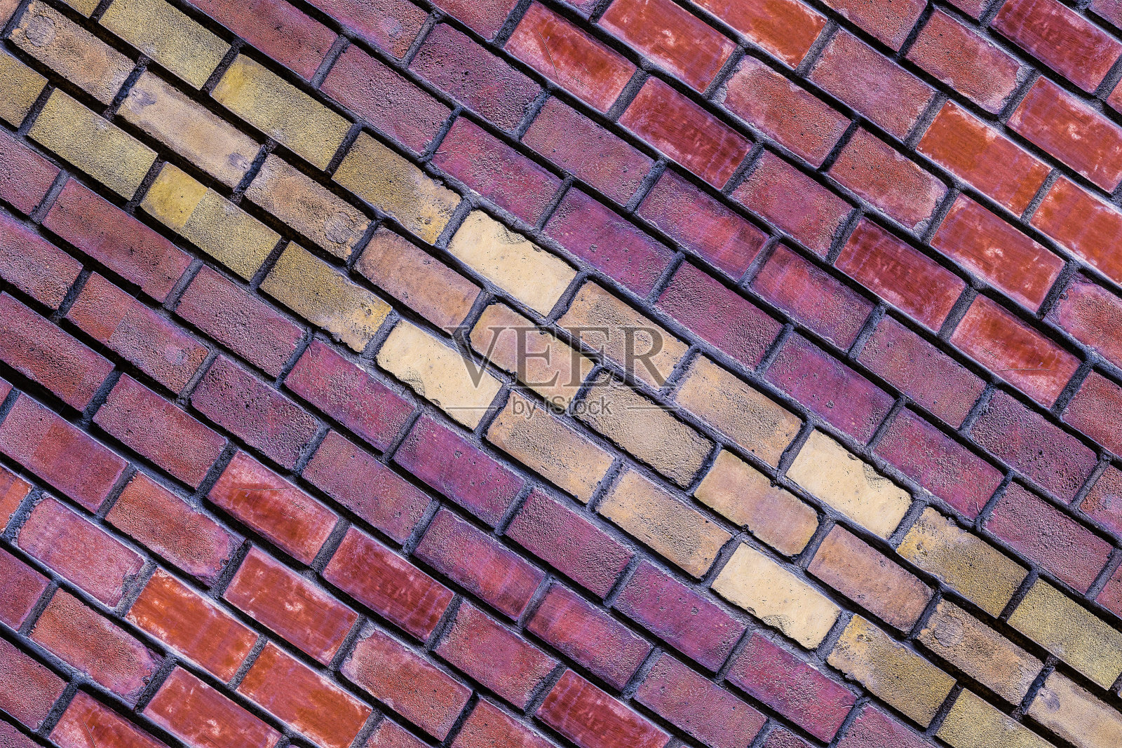 红棕色的方块与黄色中心倾斜的背景基地的石头窗格砖排城市设计照片摄影图片