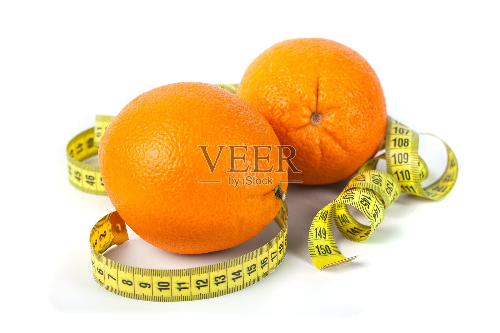 橙色水果与测量孤立在白色。照片摄影图片