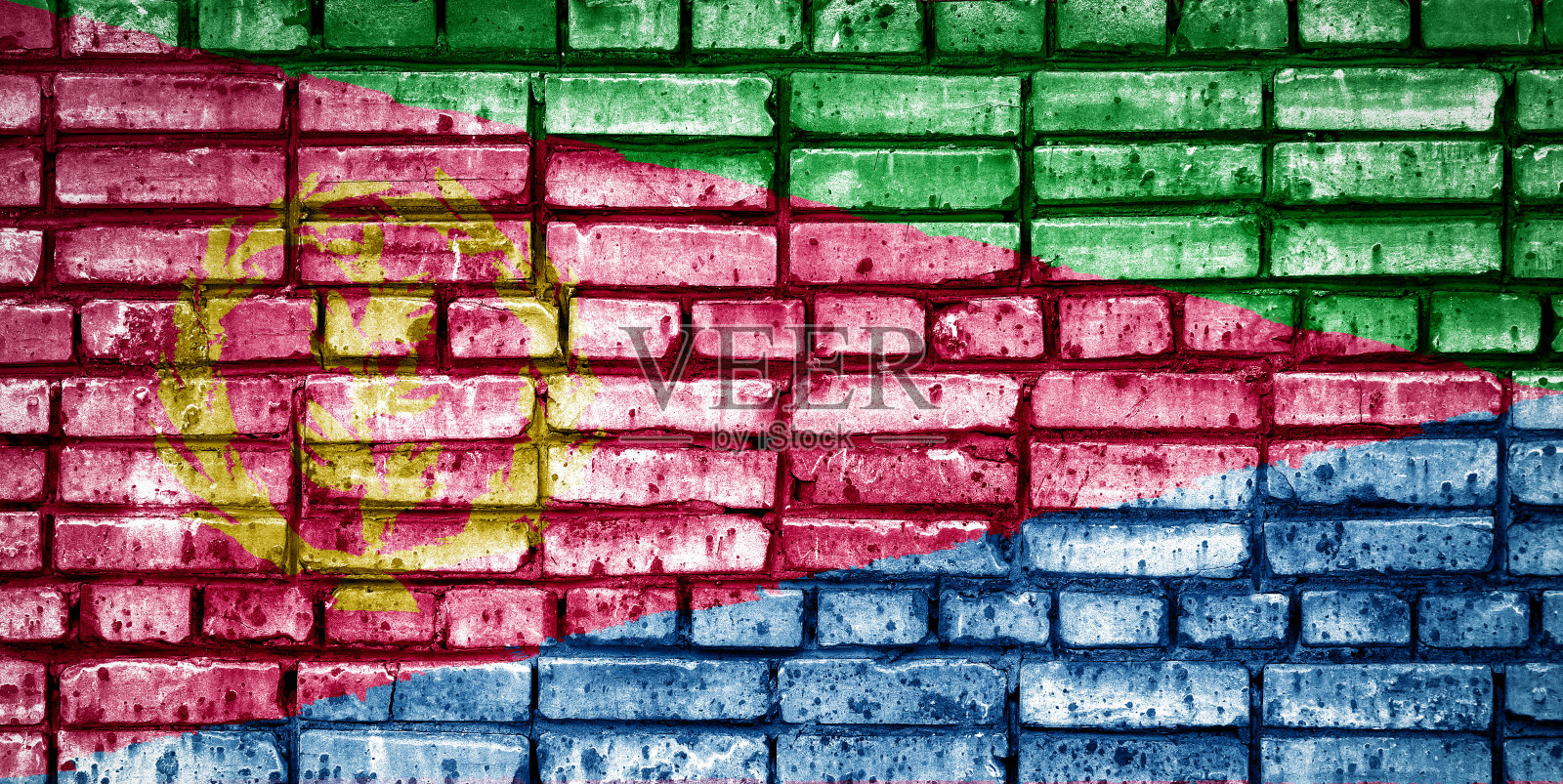 砖块背景上的厄立特里亚国旗。照片摄影图片