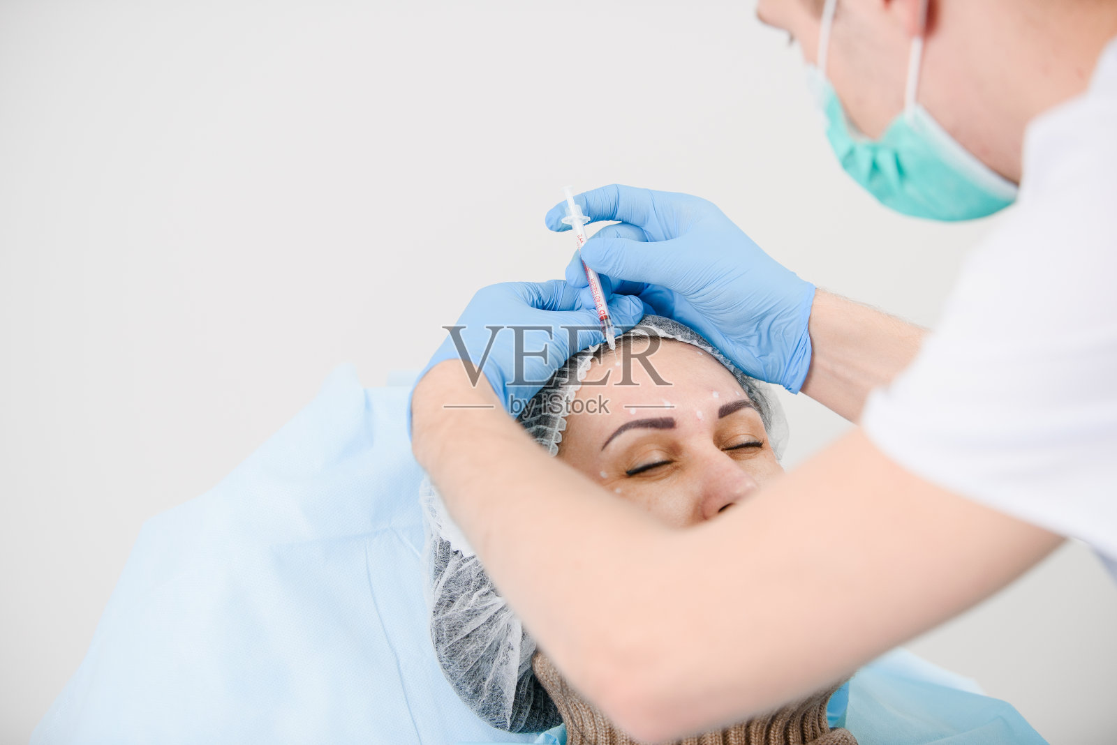 肉毒杆菌注射。肉毒杆菌毒素是一种由肉毒梭菌及其相关物种产生的神经毒性蛋白。照片摄影图片