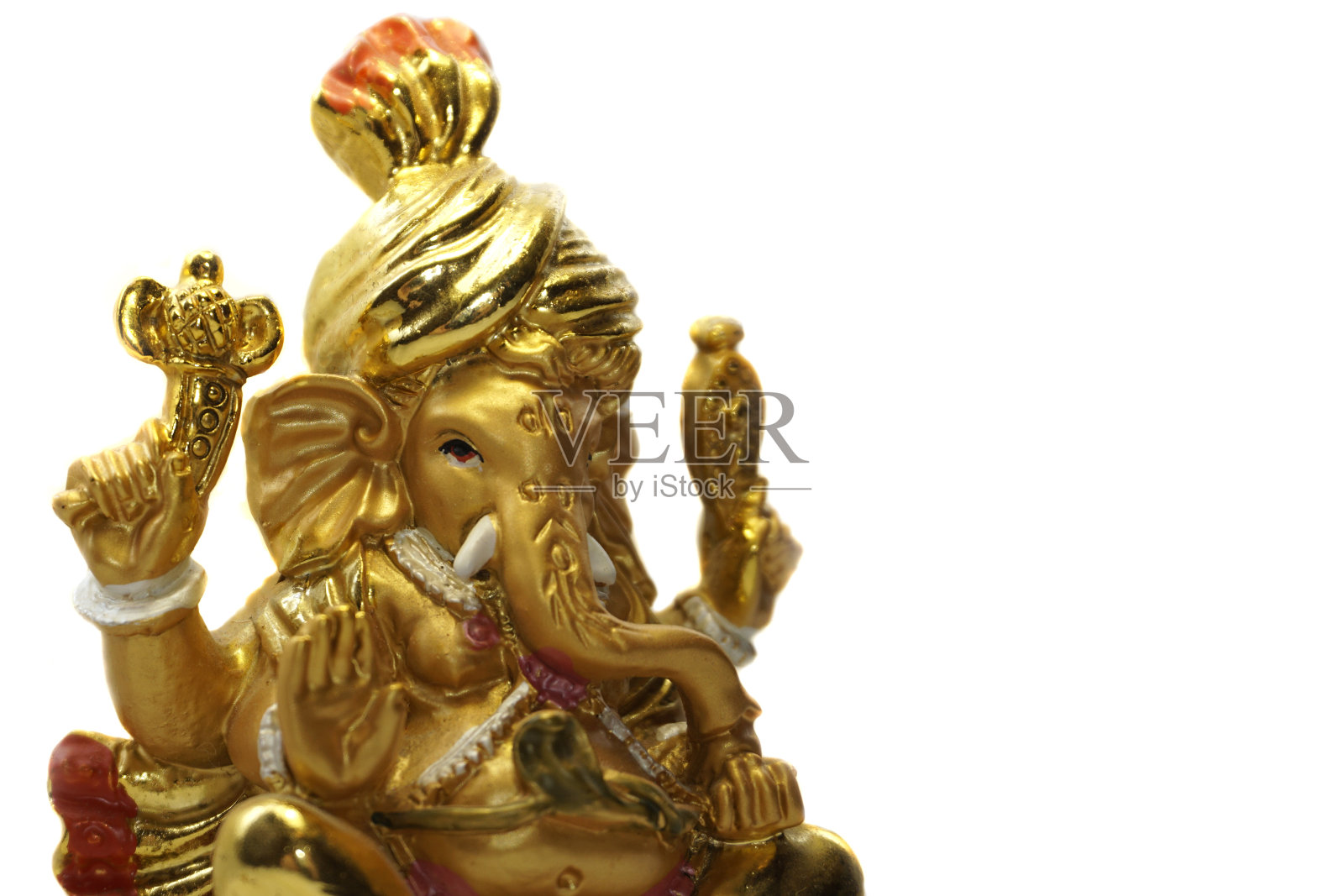 甘尼萨印度教神，金色甘尼萨偶像孤立在白色的背景照片摄影图片