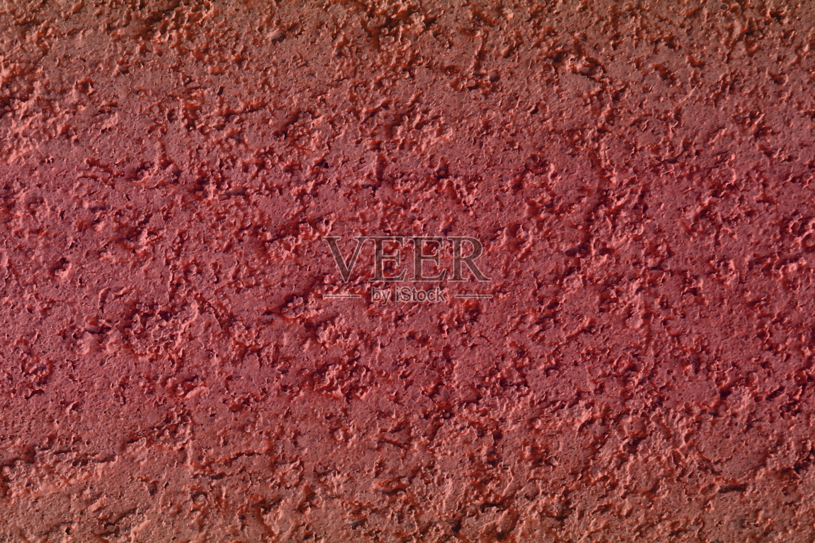 漂亮的复古红色石灰石像灰泥纹理使用作为背景。照片摄影图片