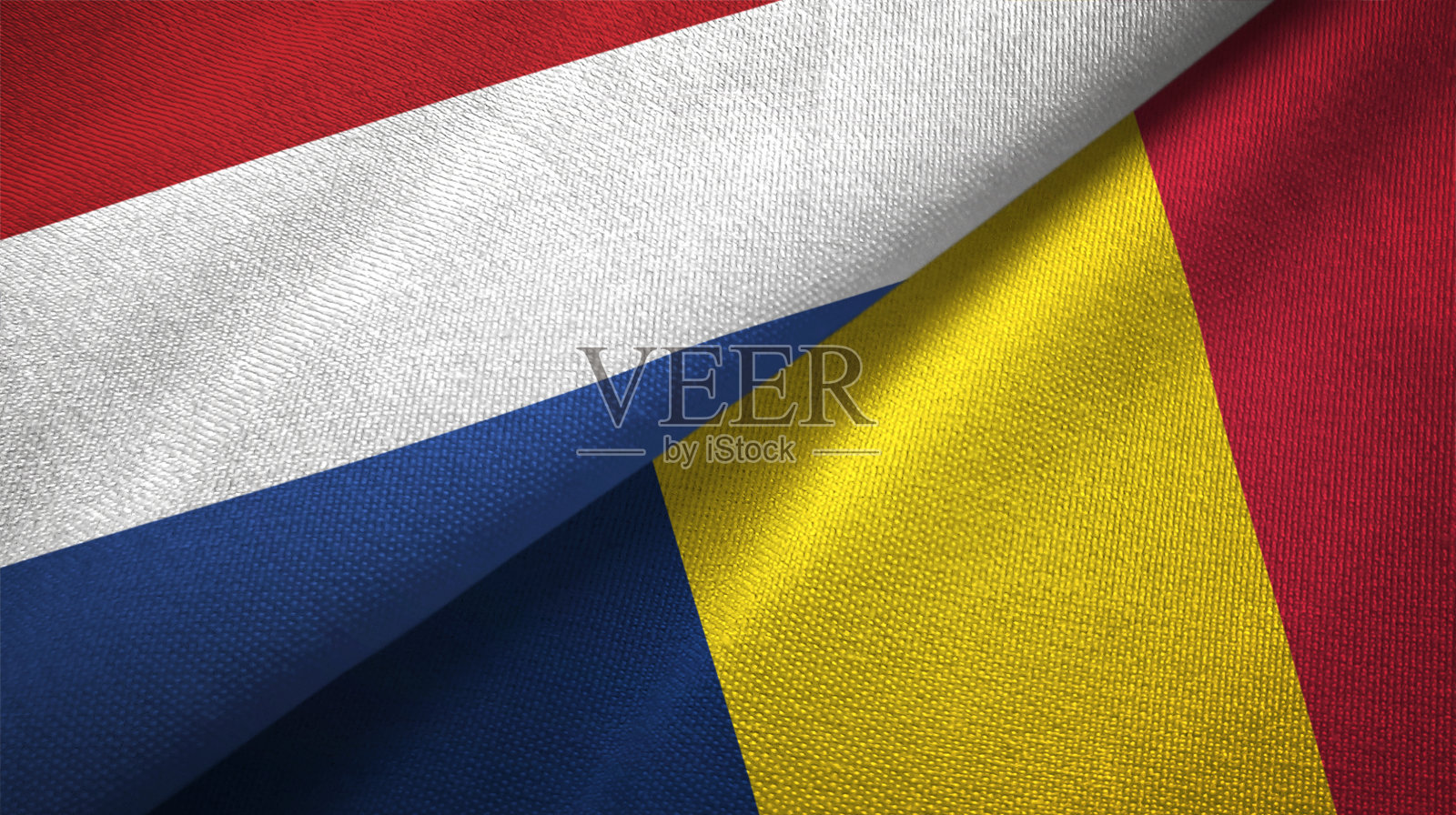 乍得和荷兰两旗织物结合在一起，织物质地照片摄影图片
