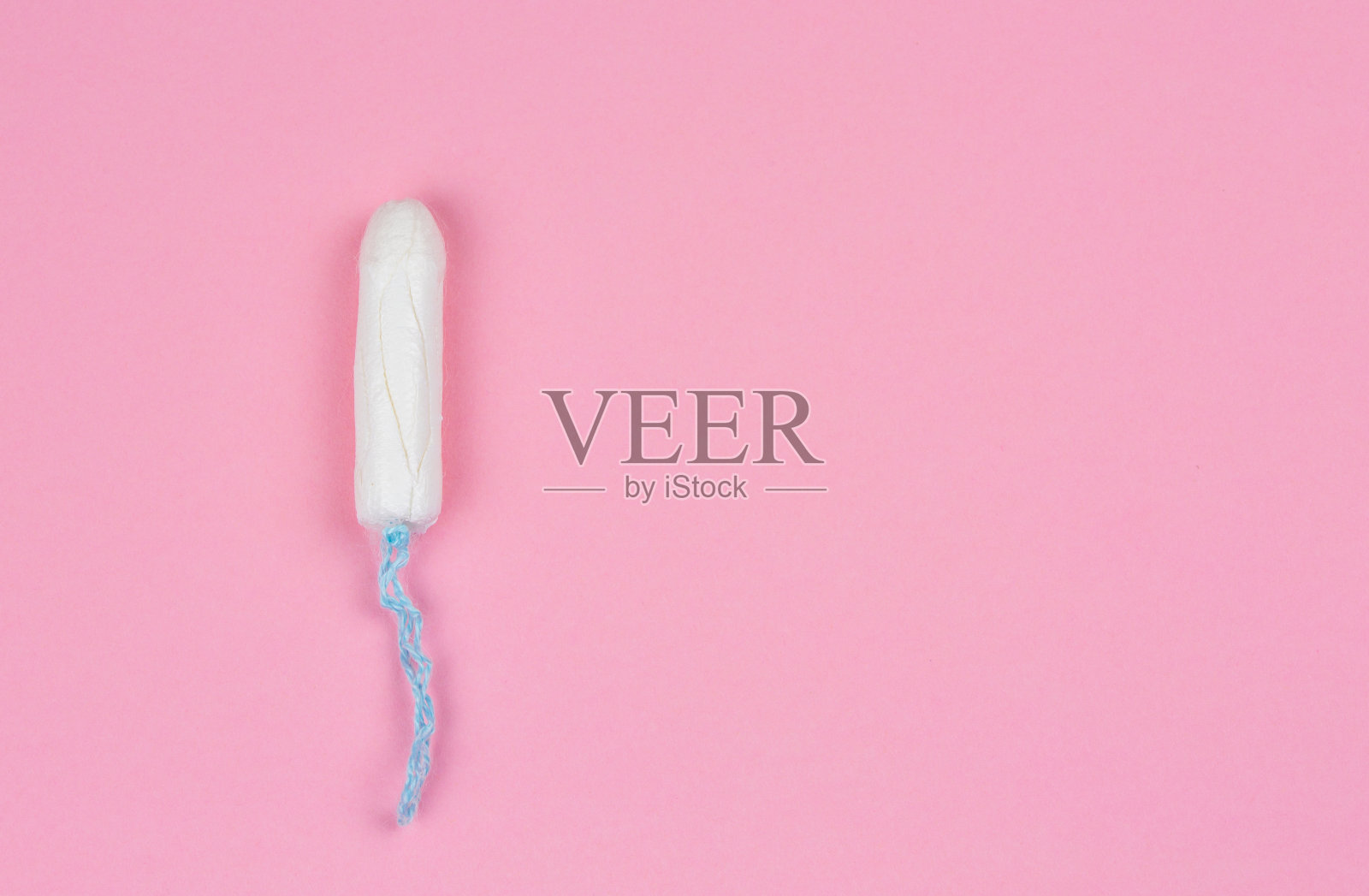 粉色背景的卫生棉条照片摄影图片