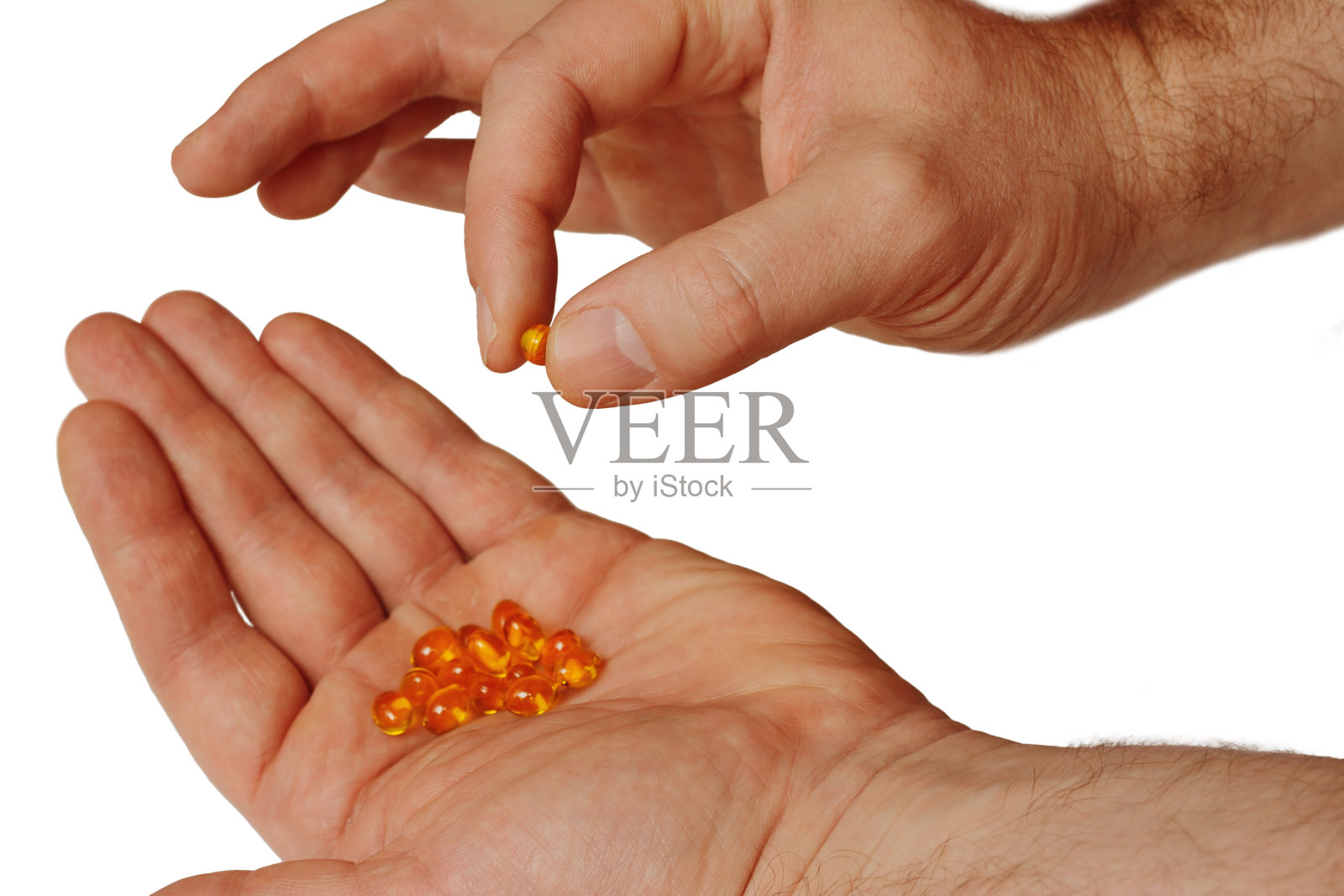 手握一把药丸照片摄影图片