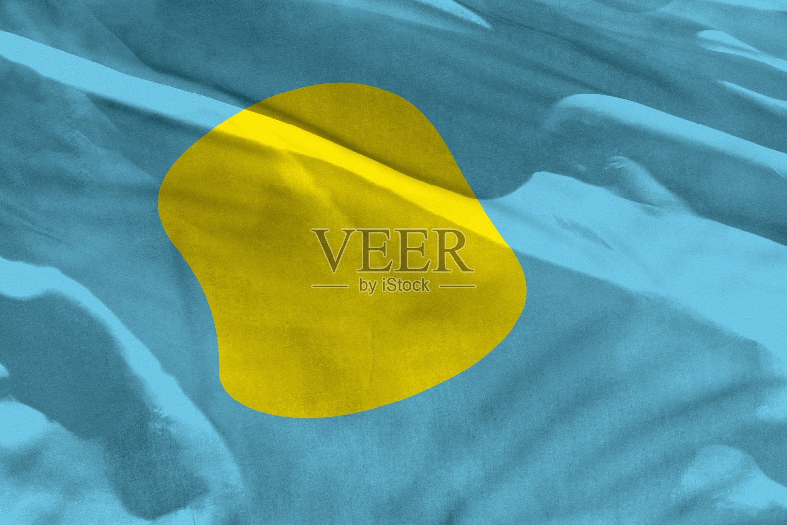 挥舞帕劳旗帜作为纹理或背景，旗帜迎风飘扬照片摄影图片