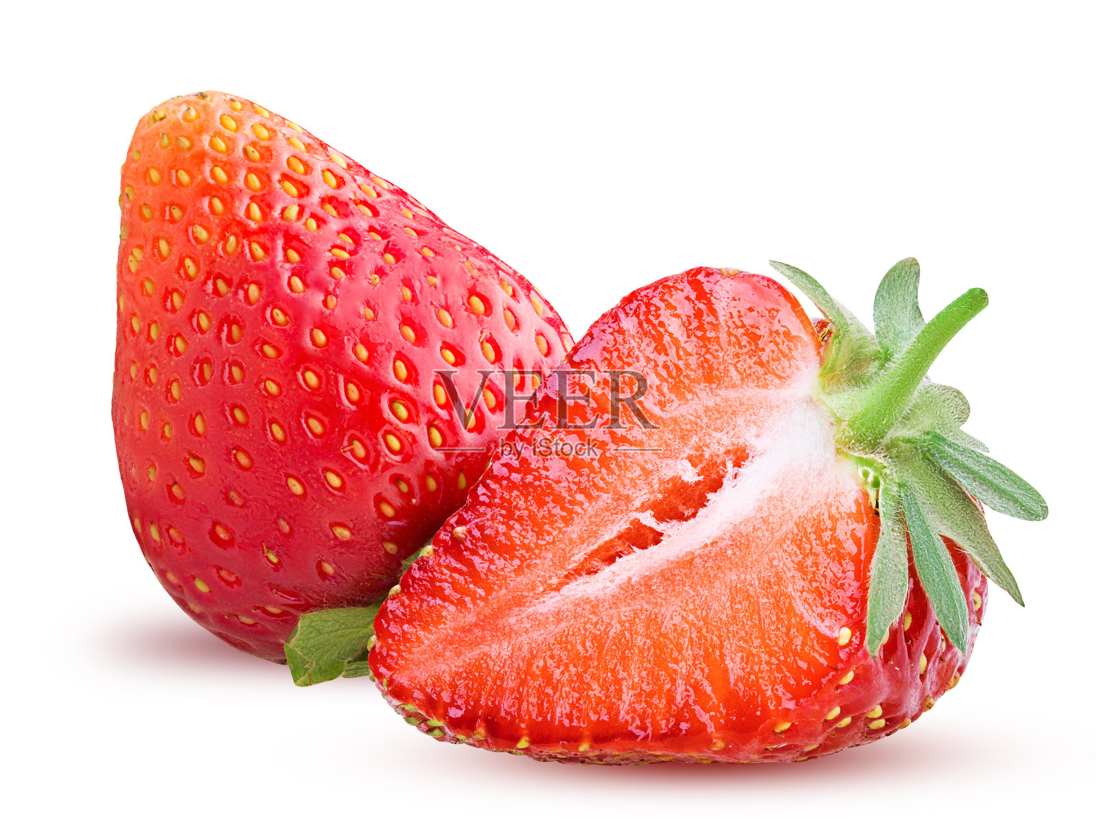 草莓和一个切成两半照片摄影图片