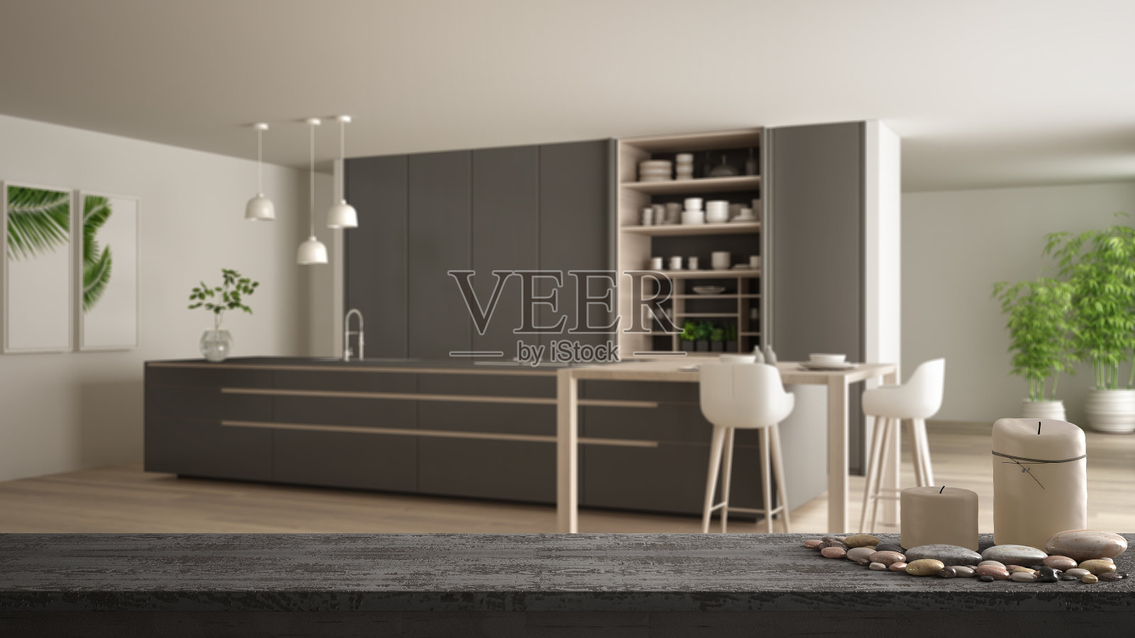 木质复古的桌面或架子上有蜡烛和鹅卵石，禅意，在现代灰色和木制厨房与岛和凳子，拼花地板，白色建筑室内设计照片摄影图片