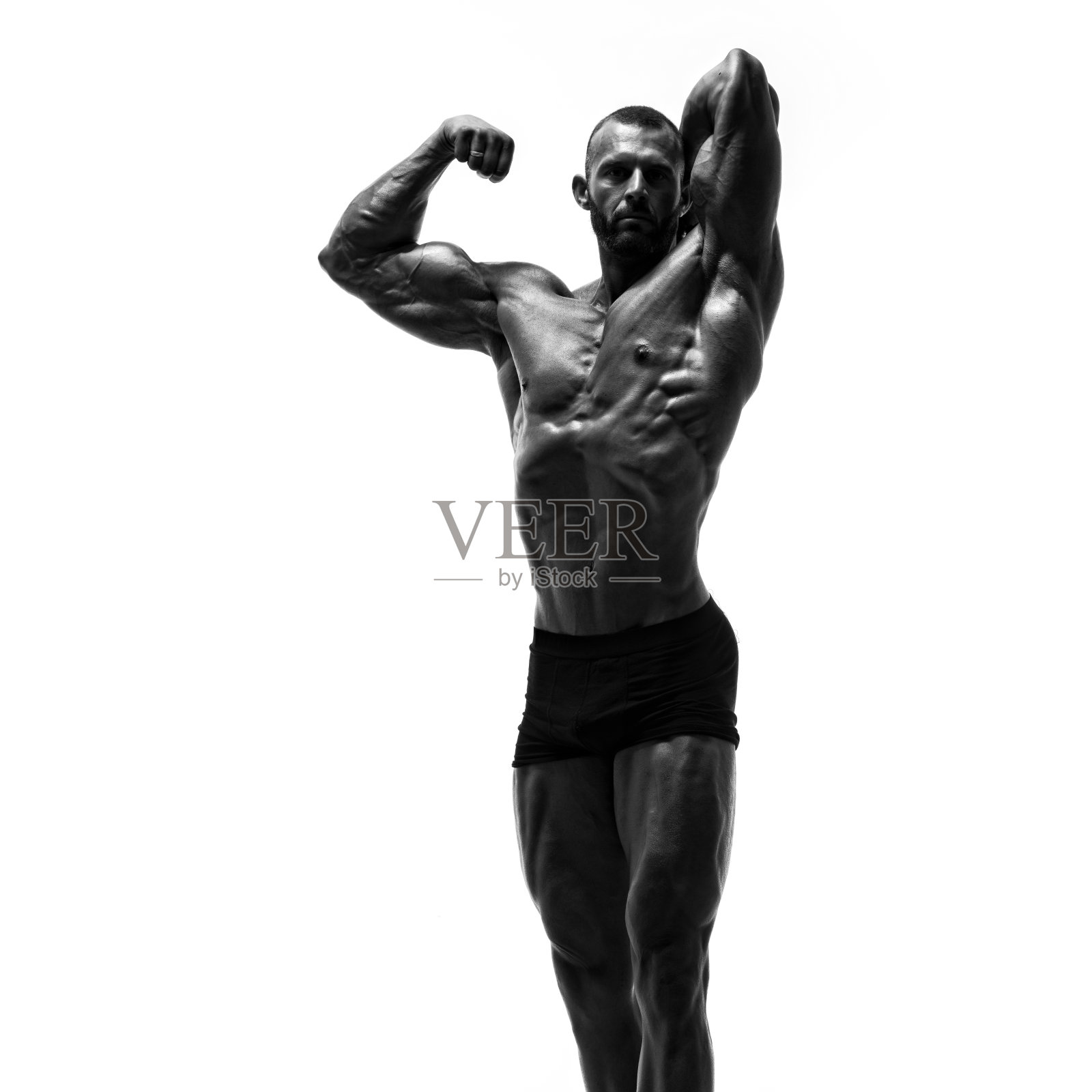 黑色和白色的形象强壮的肌肉男子伸缩肌肉照片摄影图片