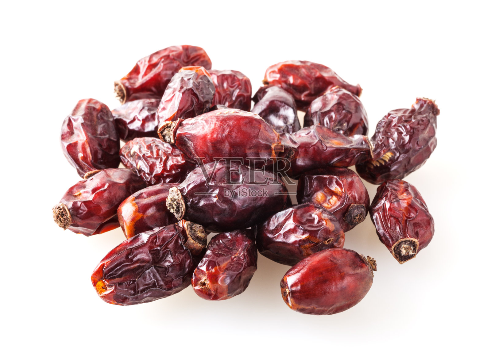 一堆干燥的狗玫瑰浆果孤立在白色的背景上照片摄影图片