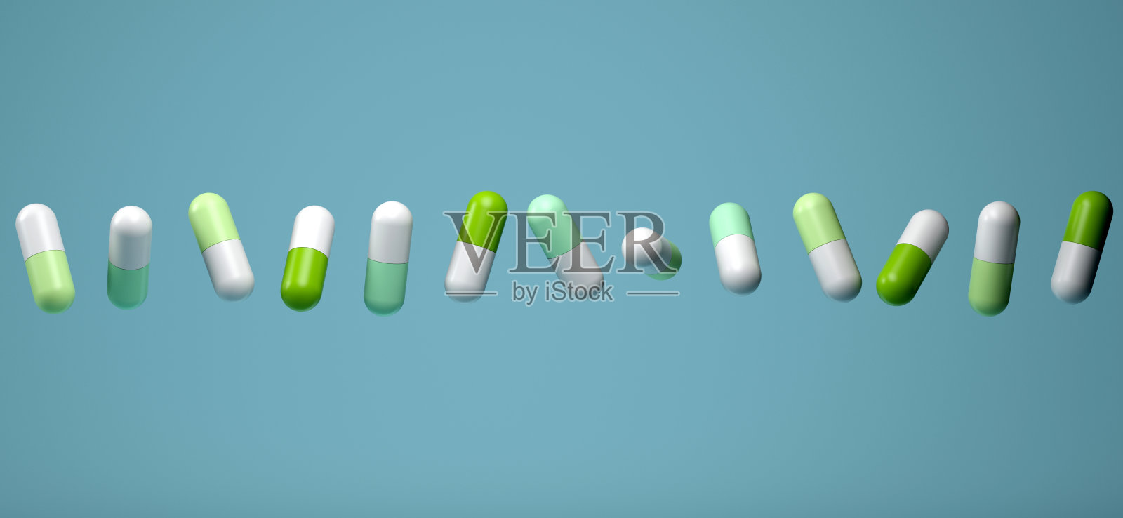 在蓝色背景下服用多种药丸和药物照片摄影图片