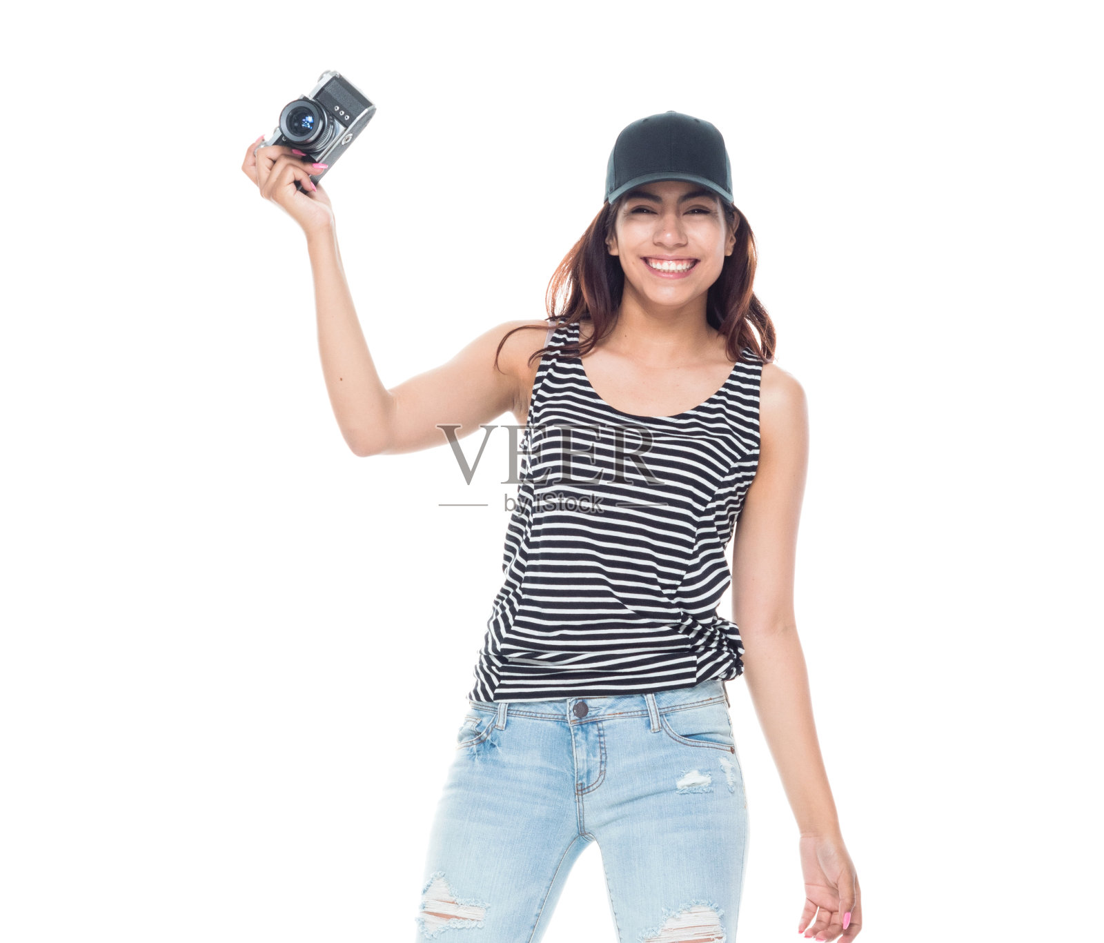 年轻美丽的拉丁女人拿着一个单反相机照片摄影图片