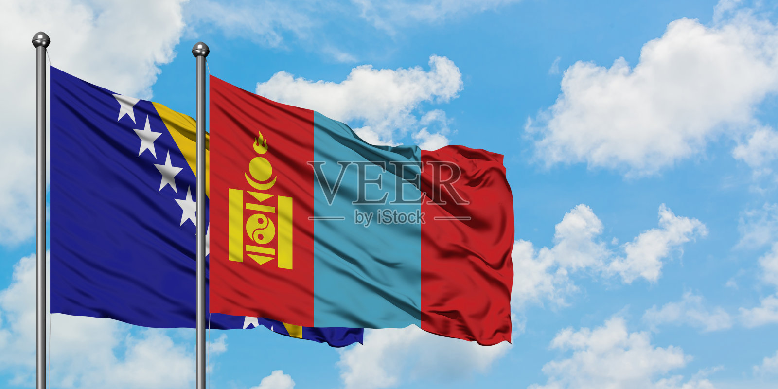 波黑和蒙古的国旗迎风飘扬，对抗着白云密布的蓝天。外交理念，国际关系。照片摄影图片