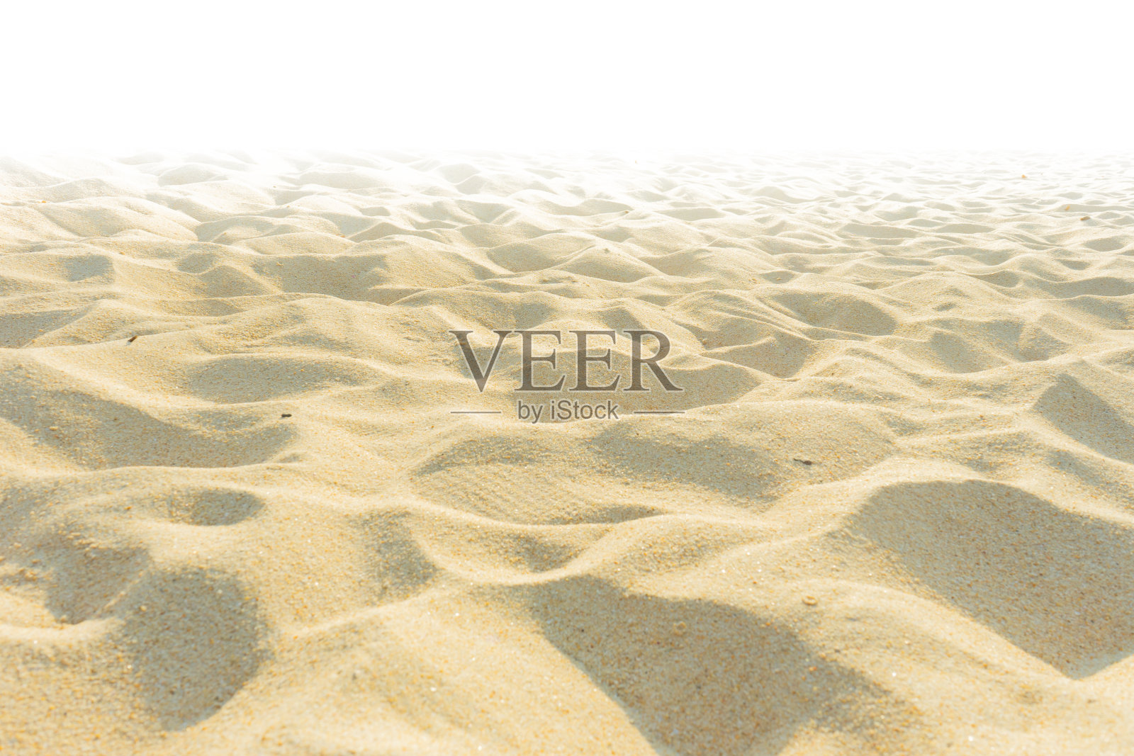 细沙在夏日的阳光下泛白照片摄影图片