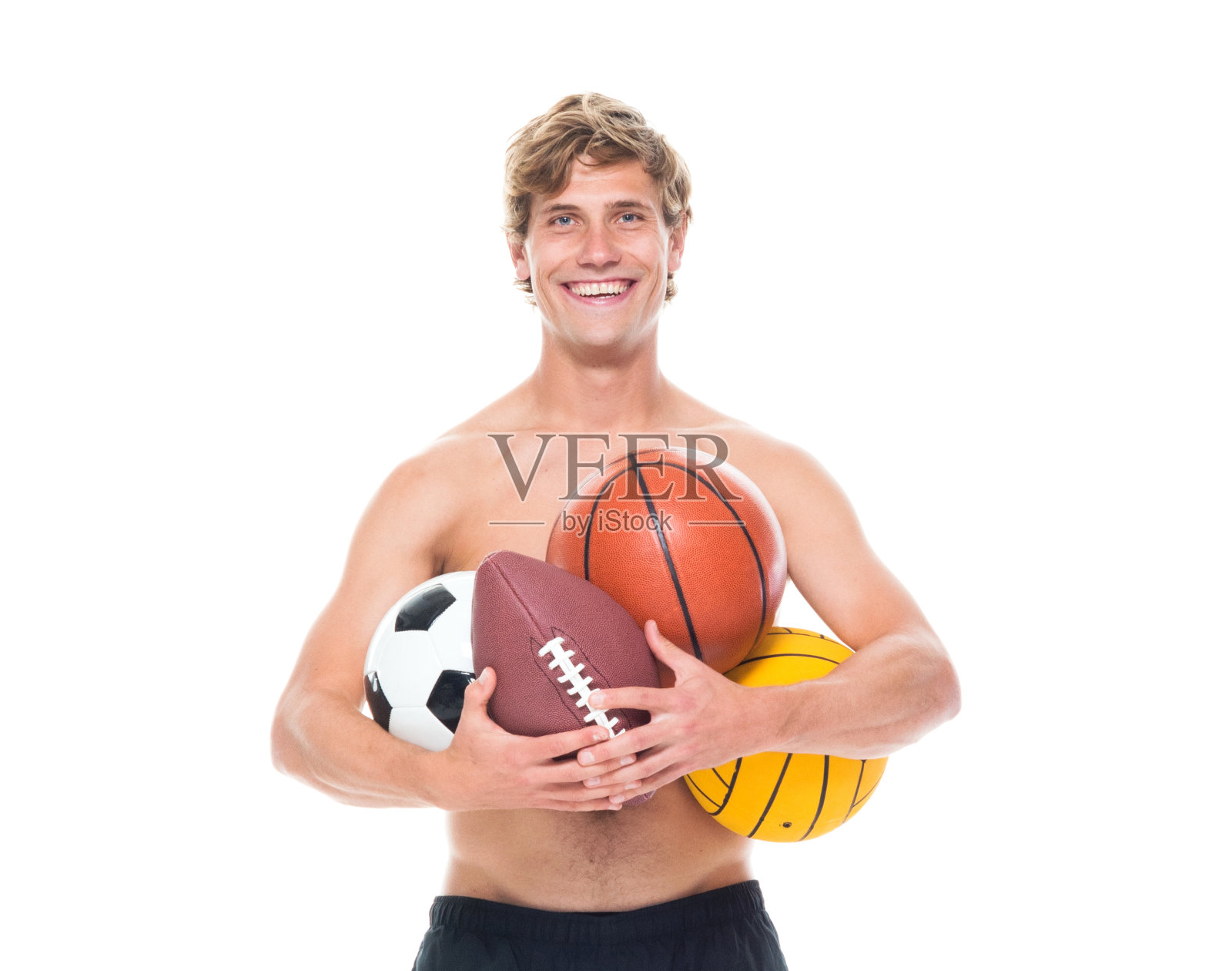 迷人的赤膊男子在运动服装持有运动球照片摄影图片