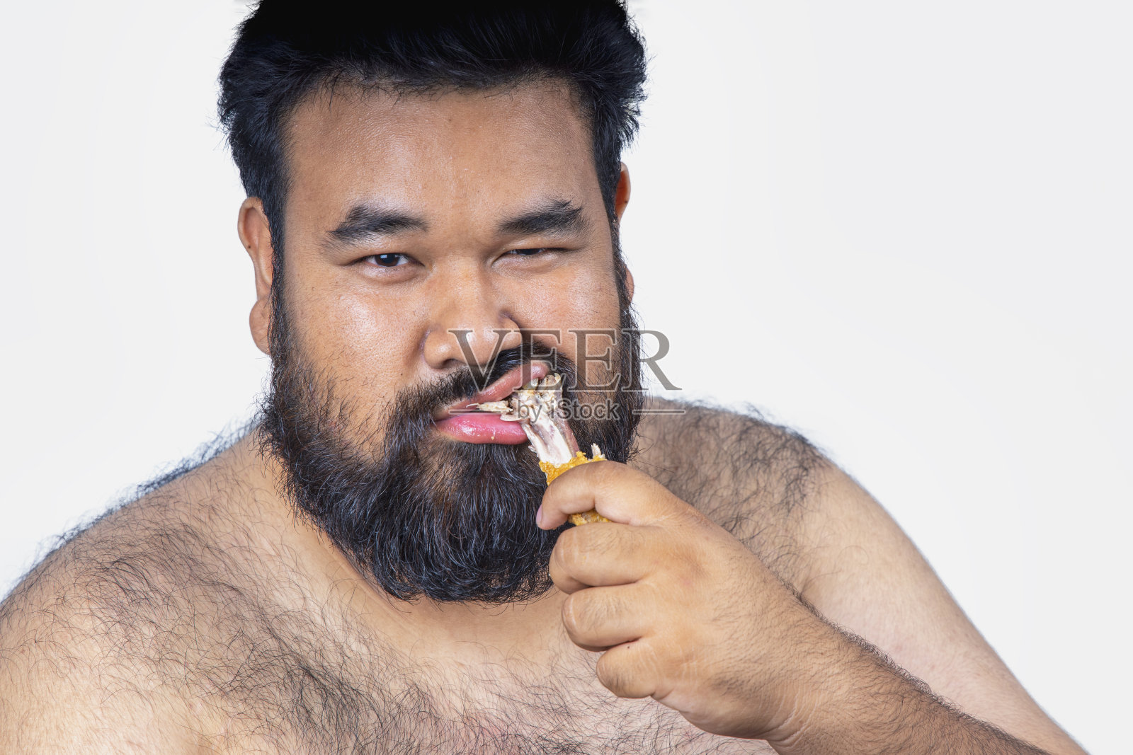 一个大肚子的胖子。照片摄影图片