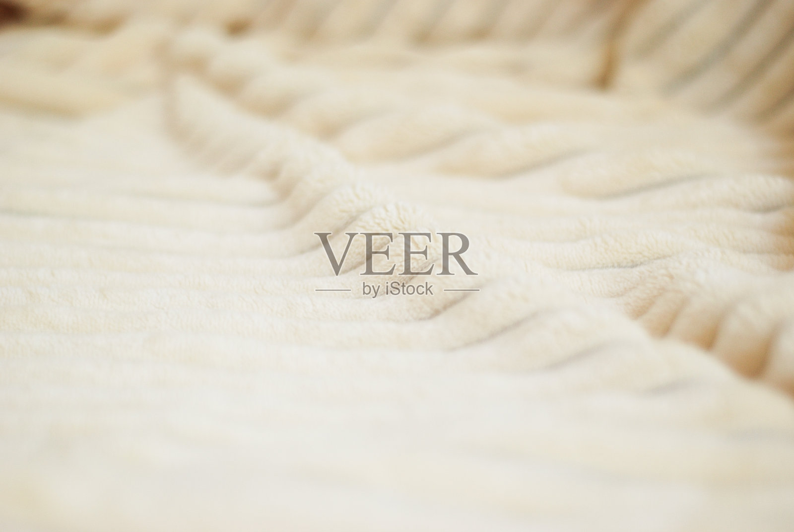 柔软的婴儿米色浅褐色条纹织物。照片摄影图片