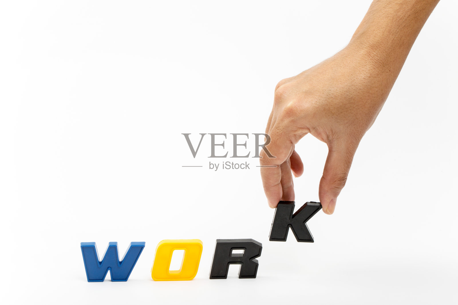 工作理念，手用塑料字母照片摄影图片