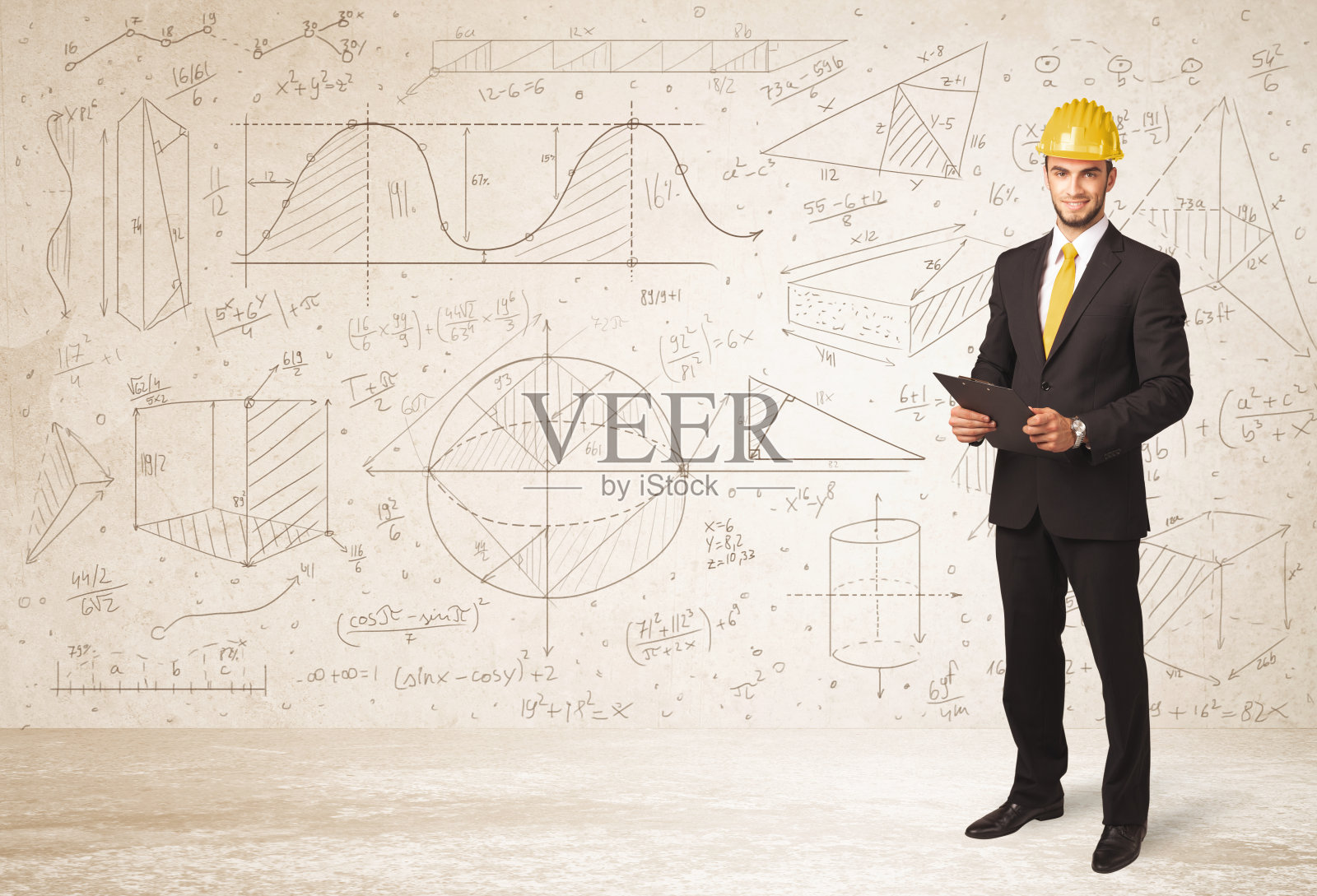 英俊的工程师计算与手绘背景照片摄影图片