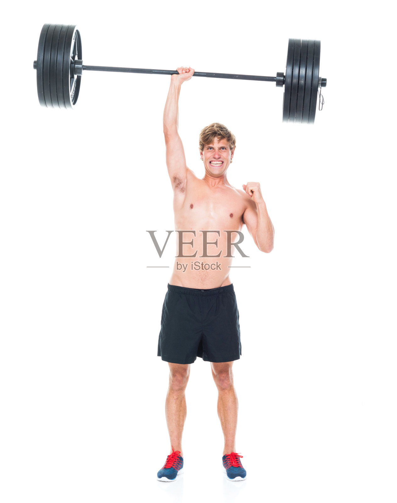 迷人的赤膊男子在运动服装和举重照片摄影图片